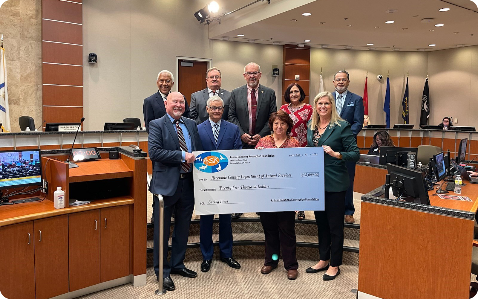 A photo of the big check ASK Foundation laid on the Riverside County Board of Supervisors.